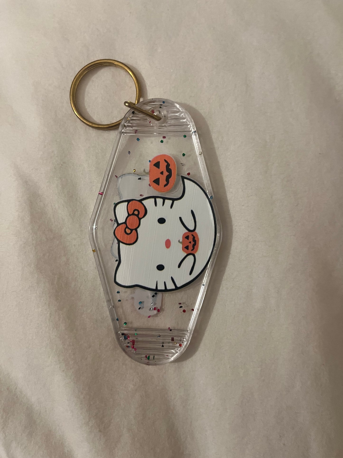 Hk clear ghost sideways motel keychain